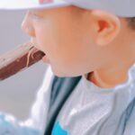 kid eating an ice cream bar